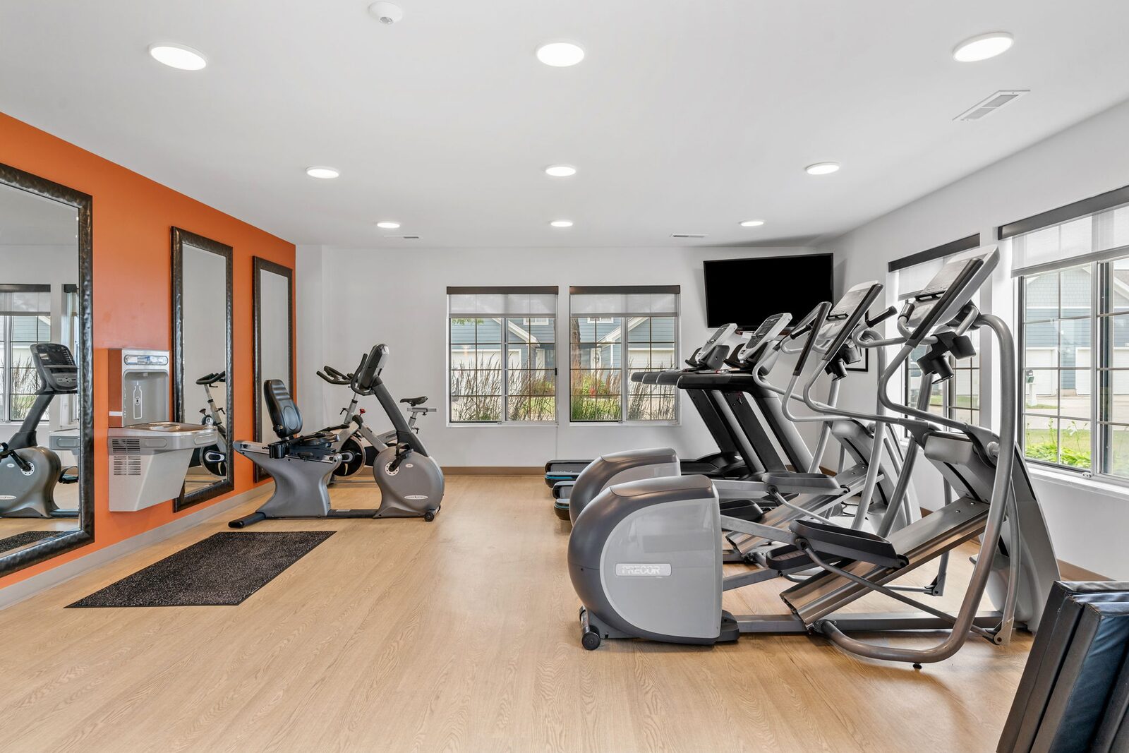 Fitness center with cardio equipment at Mequon Trail Townhomes