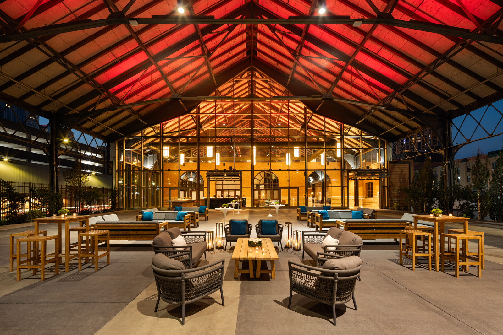 Covered outdoor lounge at The Shed in Minneapolis at dusk